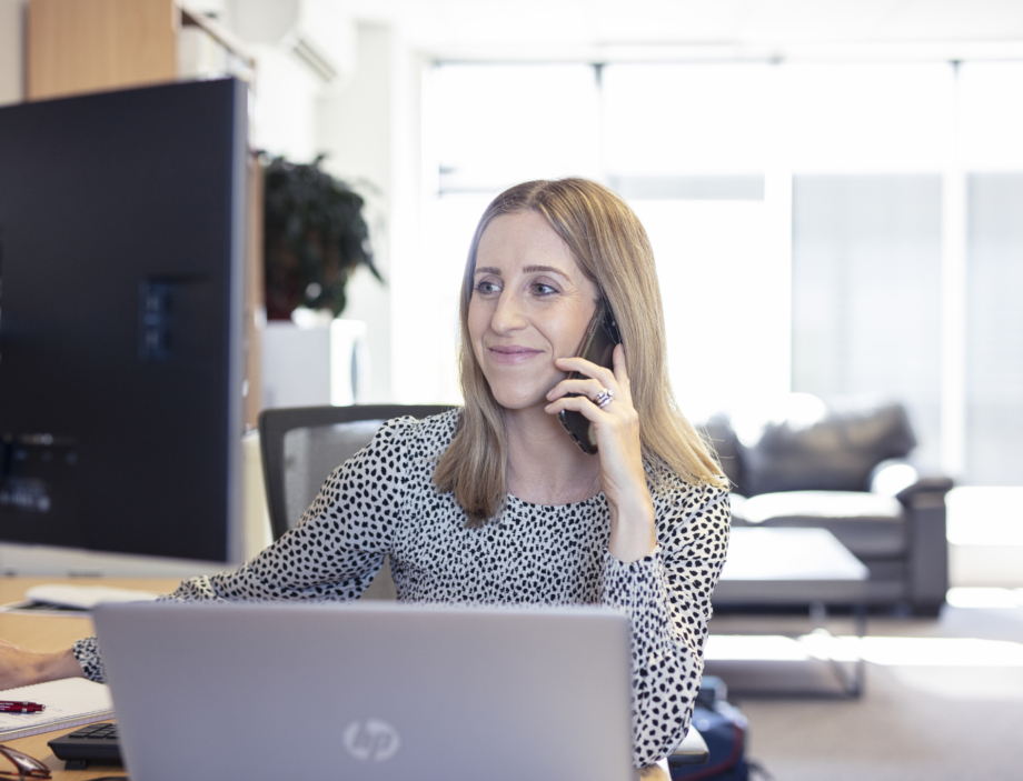 An iTops engineer working at their desk